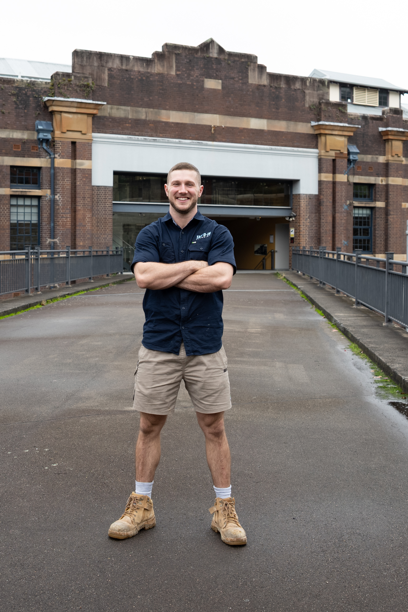 Jayden McDonald, licensed plumber Baulkham Hills, standing in branded work shirt